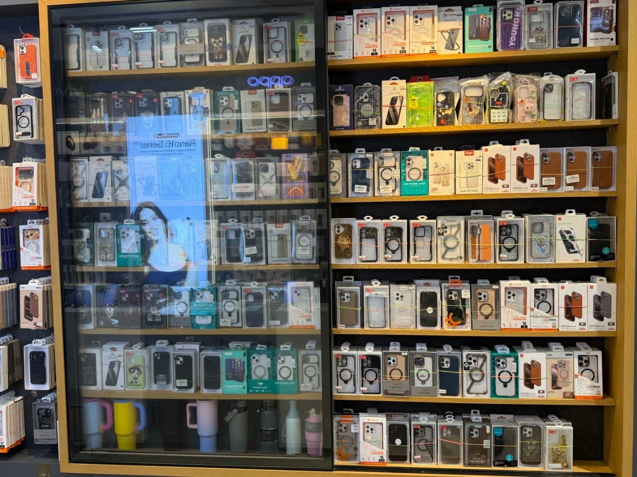 Premium mobile accessories arranged on the showroom wall